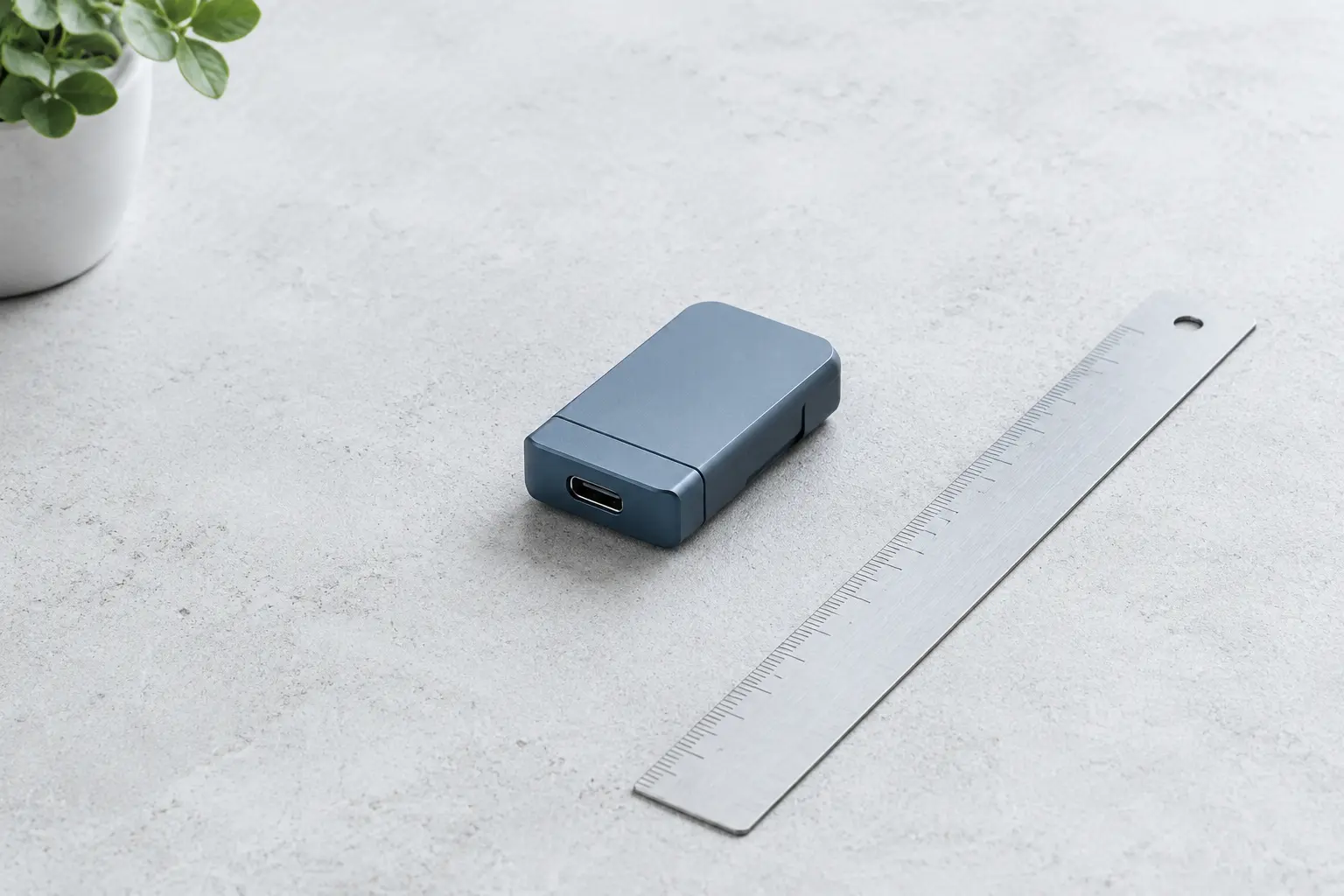 A precision pod device arranged on a white studio desk